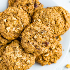 Oatmeal date cookies on a white plate.