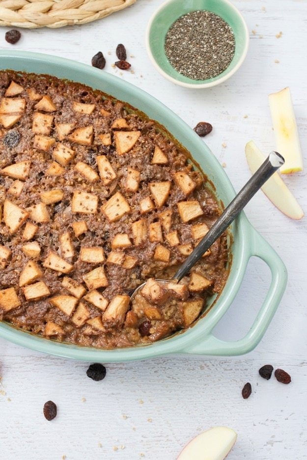 Oval baking dish of apple cinnamon baked steel cut oats.