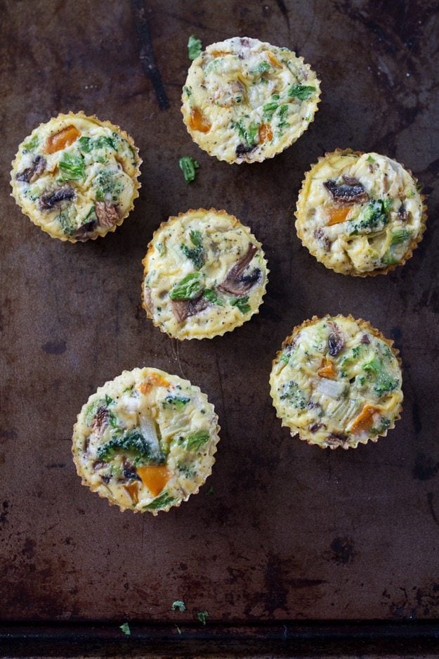 Overhead shot of egg muffin cups on a baking tray. 