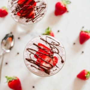 Chocolate Covered Strawberry Chia Pudding with creamy coconut milk, strawberries and a chocolate drizzle.