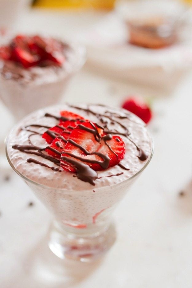 Chocolate Covered Strawberry Chia Pudding with creamy coconut milk, strawberries and a chocolate drizzle.