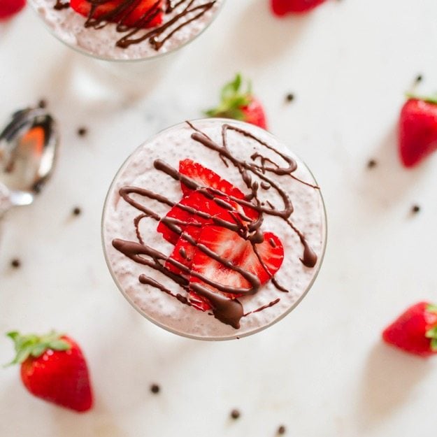 Chocolate Covered Strawberry Chia Pudding with creamy coconut milk, strawberries and a chocolate drizzle.