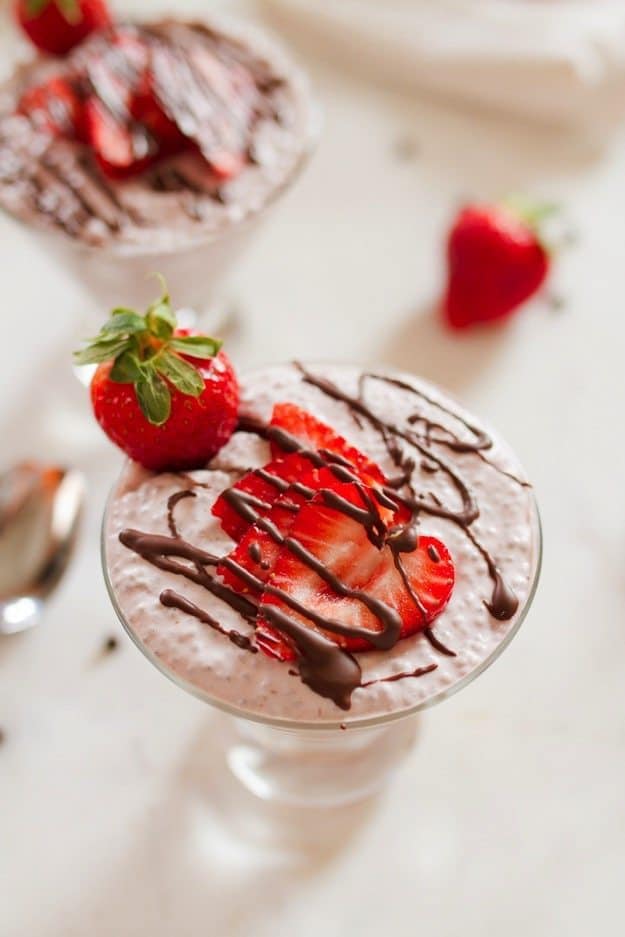 Chocolate Covered Strawberry Chia Pudding with creamy coconut milk, strawberries and a chocolate drizzle.