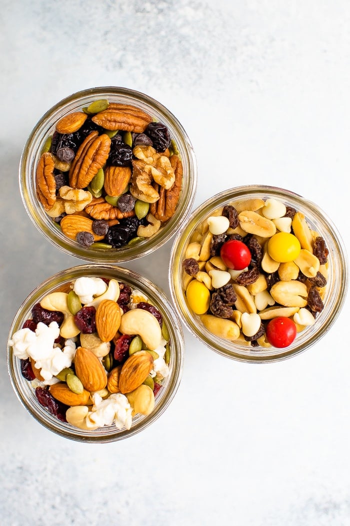 Three mason jars of different trail mixes.