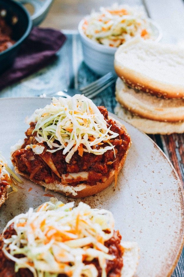 The BEST vegan BBQ sandwiches made with shredded hearts of palm, homemade BBQ sauce and a crunchy apple cider vinegar coleslaw. 