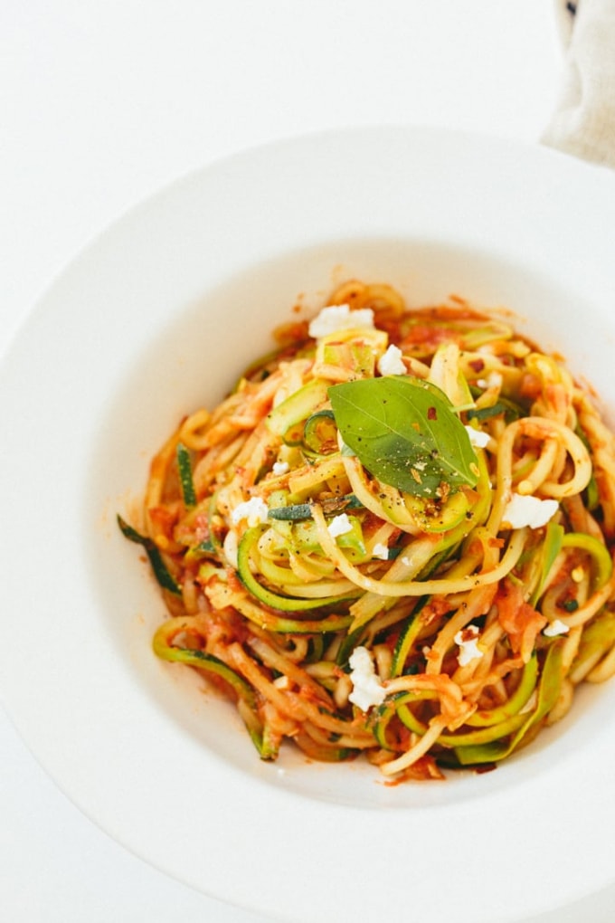 Inspiralized tomato basil zucchini pasta with goat cheese and asparagus.