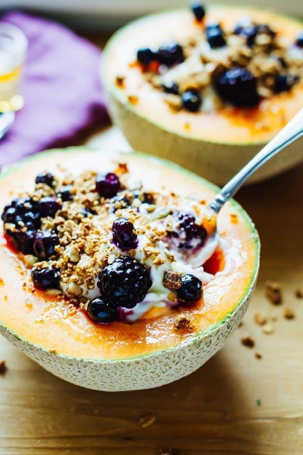 Save the recipe for these delicious Cantaloupe Breakfast Bowls for later! Cantaloupe Breakfast Bowls with Greek Yogurt, Berries, Granola and Honey