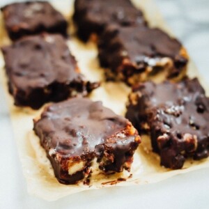 Chocolate Caramel Banana Ice Cream Bars on parchment paper.