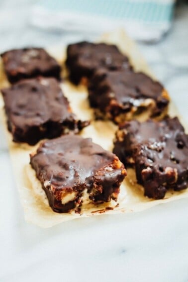 Chocolate Caramel Banana Ice Cream Bars on parchment paper.