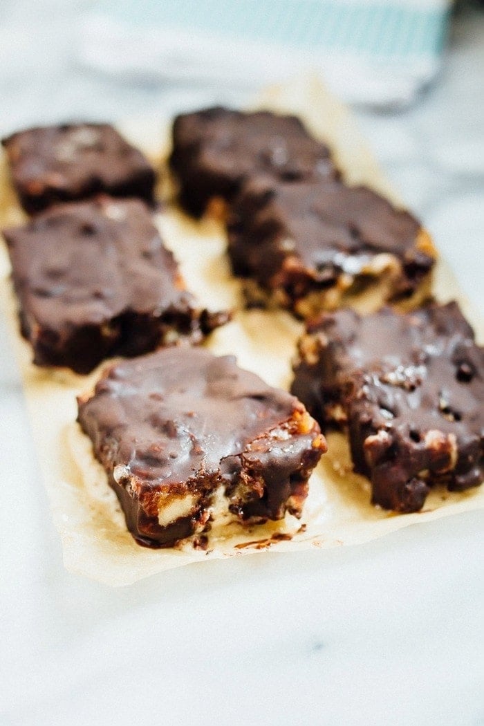 Chocolate Caramel Banana Ice Cream Bars on parchment paper. 