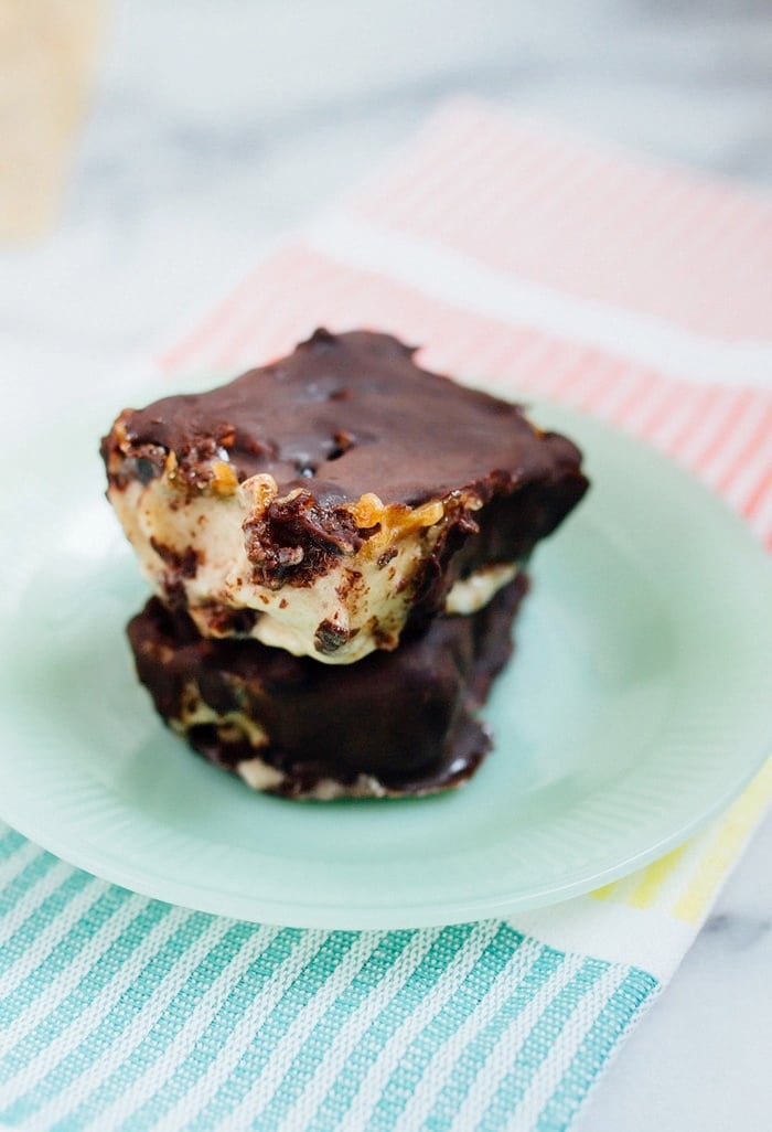 Chocolate Caramel Banana Ice Cream Bars stacked on a turquoise plate. 