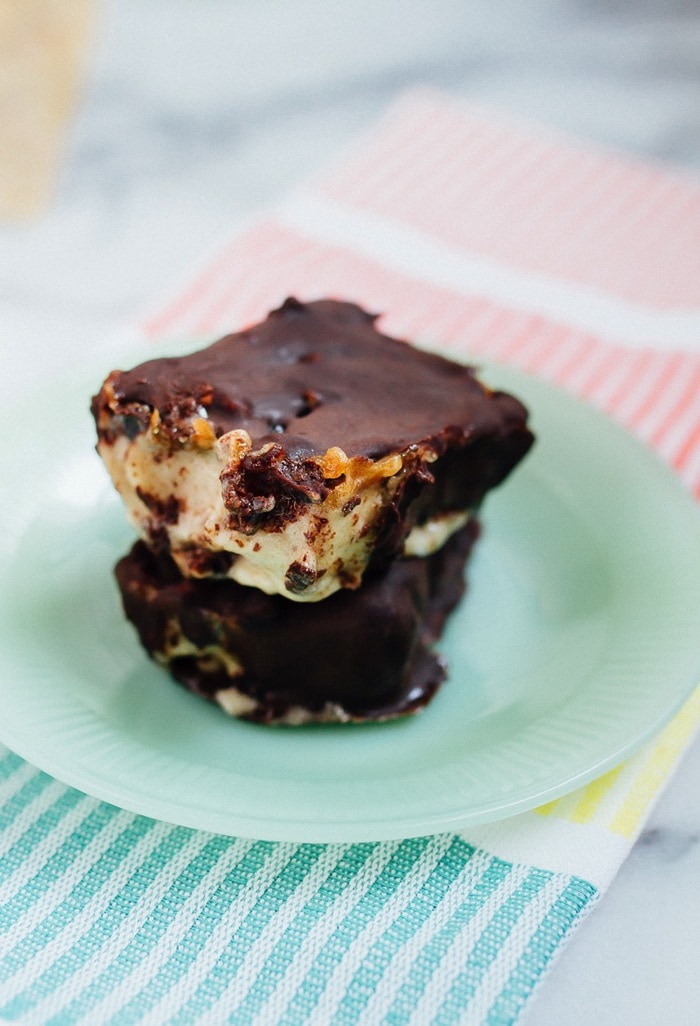 Chocolate Caramel Banana Ice Cream Bars stacked on a turquoise plate. 