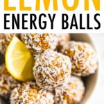 Bowl full of lemon energy balls rolled in coconut flakes. Slice of lemon is in the bowl.