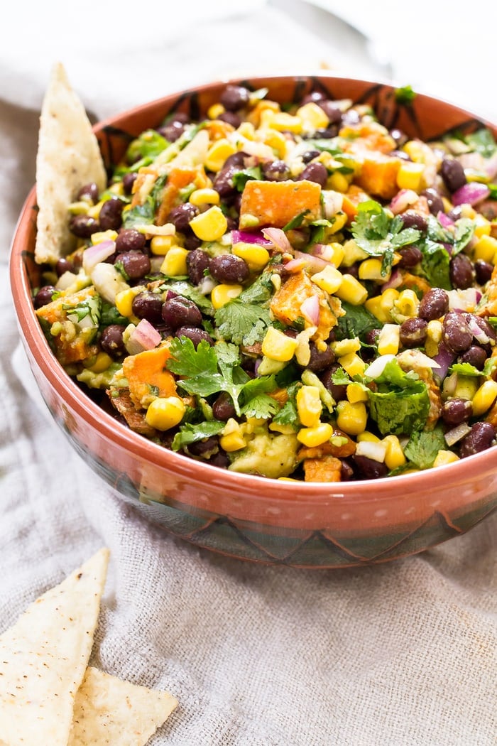 This delicious sweet potato black bean dip is loaded with flavor and perfect served with tortilla chips, as a side or as a topping for salads and tacos. #glutenfree #vegan