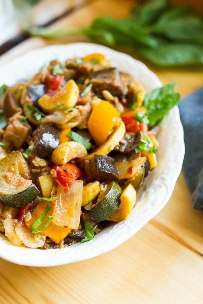 Load your summer farmers market haul into the slow cooker for a delicious ratatouille that you can use in a variety of ways. Serve as a side, over pasta or bread, with a grilled protein or even in an omelet. Closeup photo of ratatouille in a serving dish.