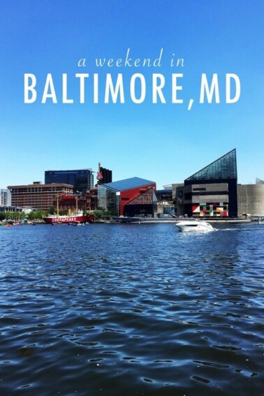 Downtown Baltimore view from the water, with the words, a weekend in Baltimore, MD, typed in the sky.