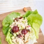 Almond butter chicken salad made with almonds, celery and grapes in lettuce cups.