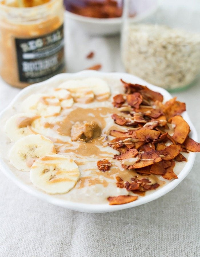 A bowl of peanut butter banana and bacon overnight oats.