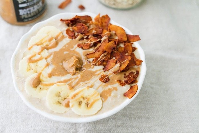 A bowl of peanut butter banana and bacon overnight oats.