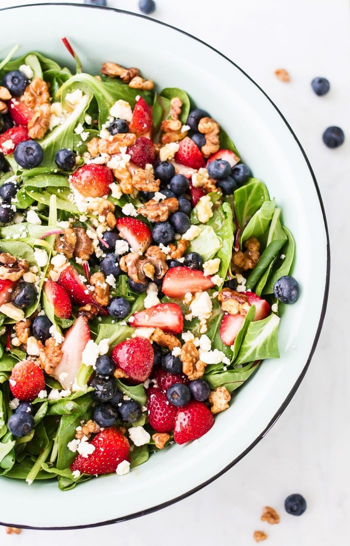 Patriotic berry salad loaded with fresh berries, crunchy maple walnuts and blue cheese. The red white and blue theme makes it perfect for the 4th of July. 