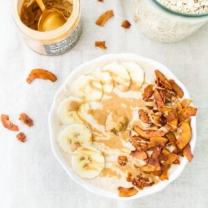 A bowl of peanut butter banana and bacon overnight oats.