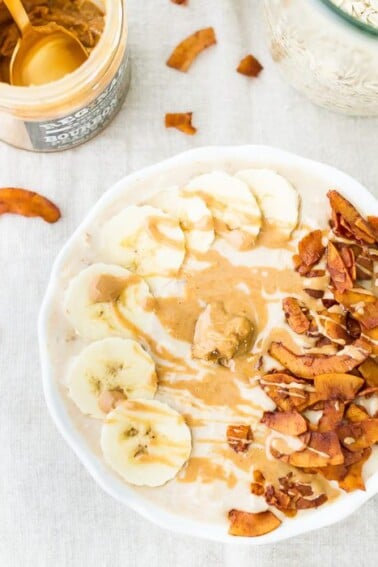 A bowl of peanut butter banana and bacon overnight oats.