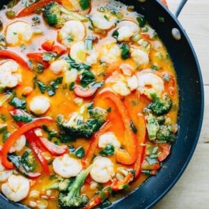 Thai coconut curry shrimp with broccoli, red pepper and shrimp in a pan.