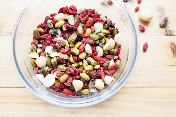 Snack healthy with this crunchy, vibrant pistachio trail mix. It’s a delicious blend of roasted pistachios, macadamia nuts, goji berries and cacao nibs. Vegan, gluten-free, low sugar and low carb! A bowl of pistachio trail mix.