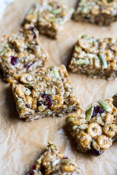 Pumpkin spice cereal squares on parchment paper.