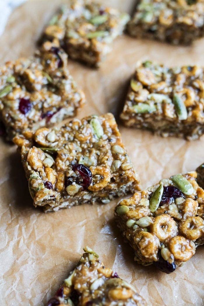 Pumpkin spice cereal squares on parchment paper.