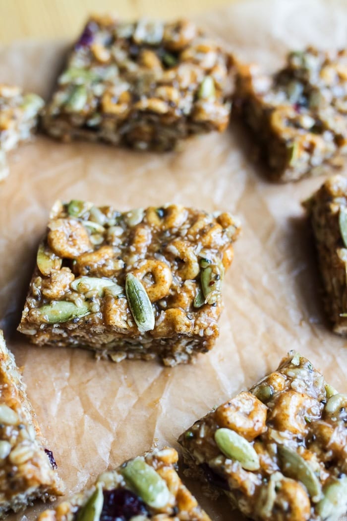 Pumpkin spice cereal squares on parchment paper.