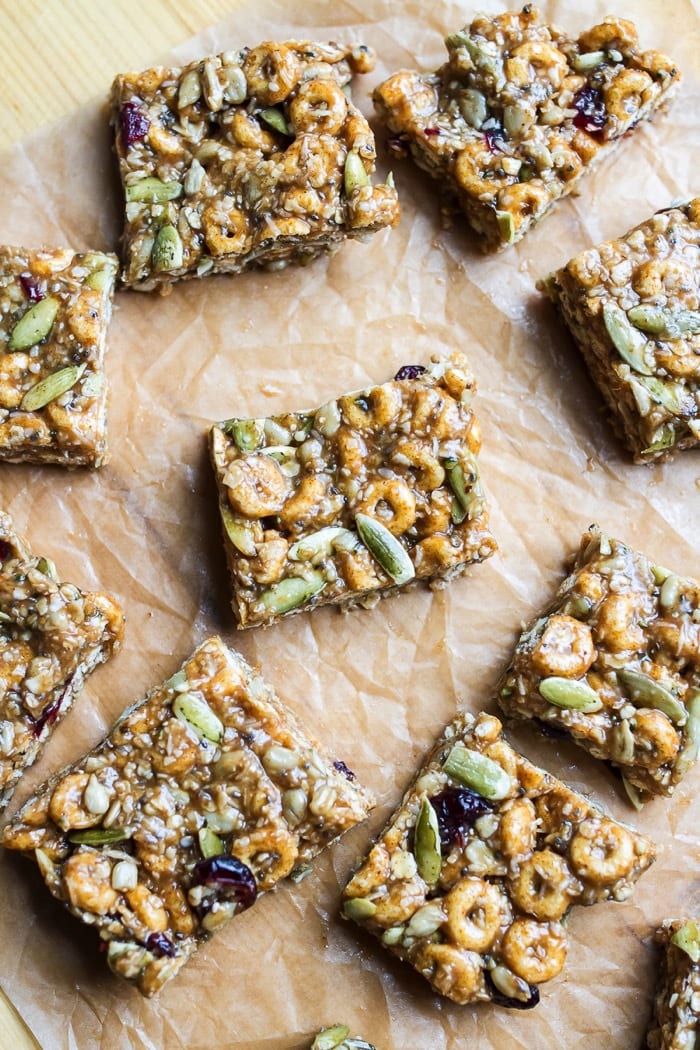 Pumpkin spice cereal square laying on parchment paper.