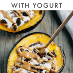 Acorn squash filled with yogurt, cranberries and seeds and a drizzle of peanut butter.