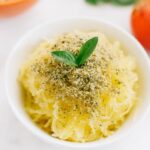 Shredded squash topped with vegan hemp parmesan and fresh basil.