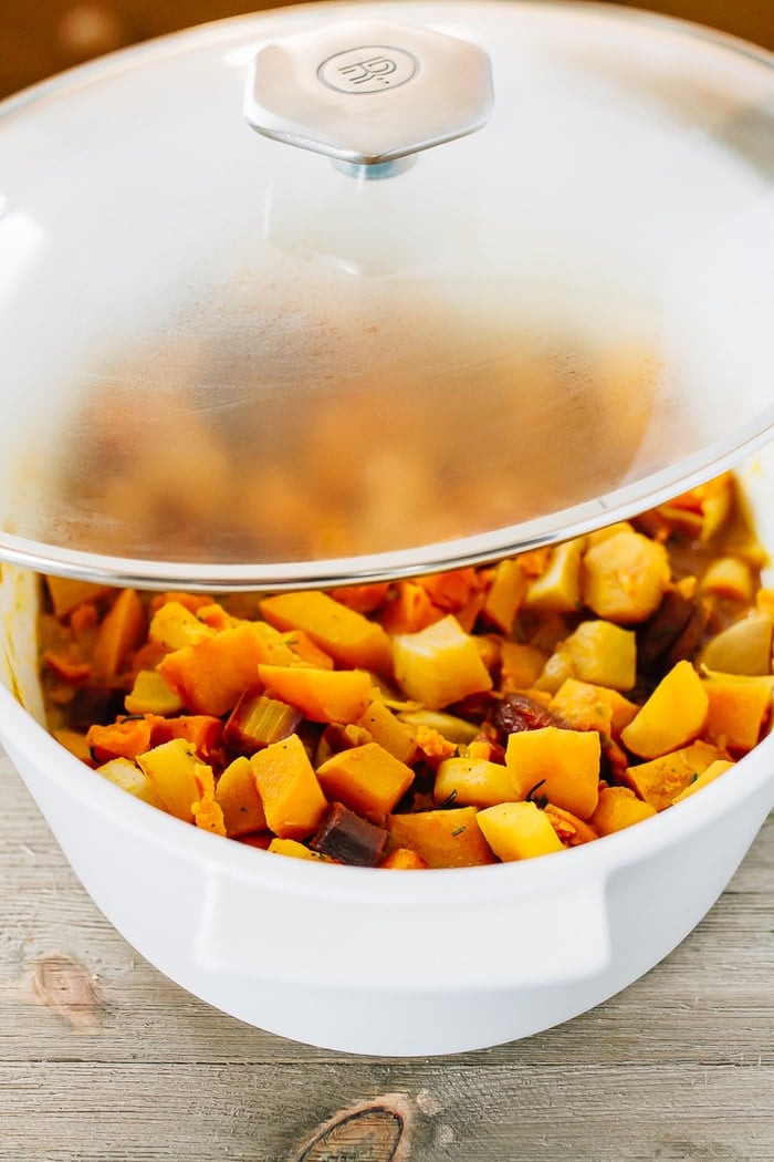 Dutch oven with roasted root vegetables and dried apricots and rosemary.