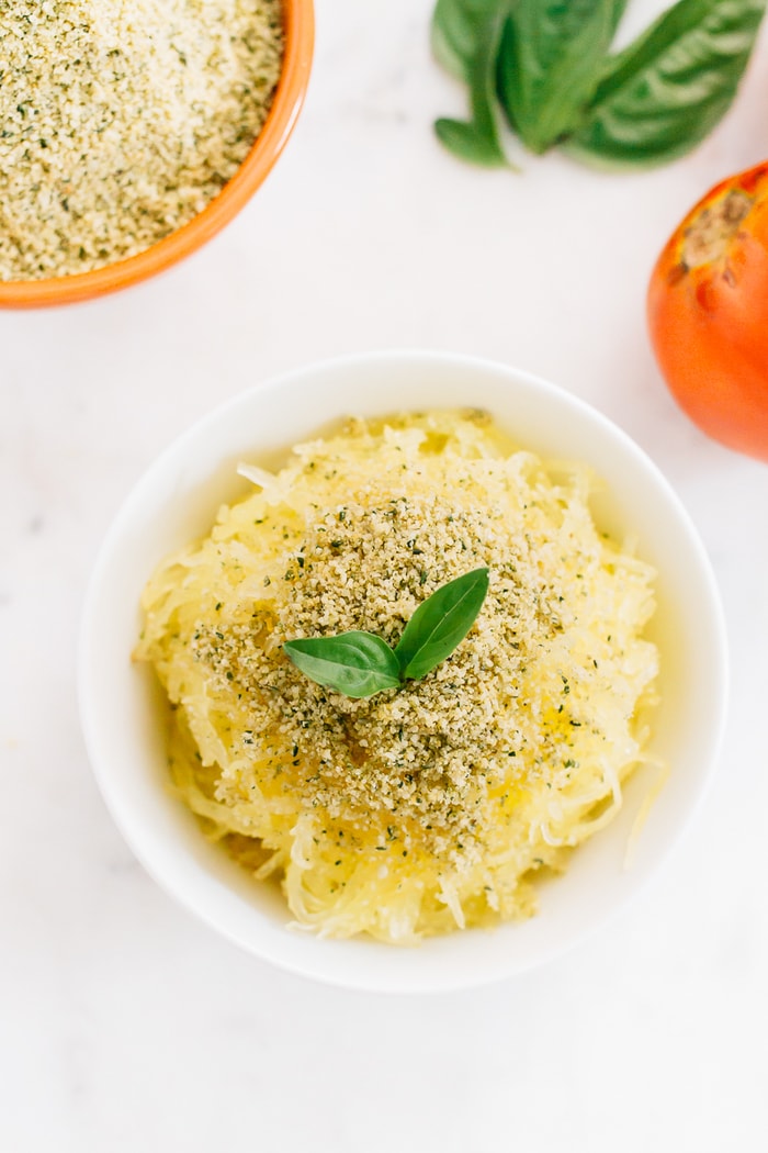 Make your own vegan parmesan cheese with hemp seeds. It’s the perfect cheesy topping for pizza, pasta, veggies, salads, popcorn and more. Shredded squash topped with vegan hemp parmesan and fresh basil.