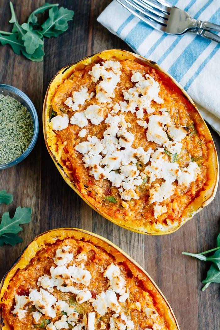 Spaghetti squash lasagna boat with sauce and topped with vegan cheese.