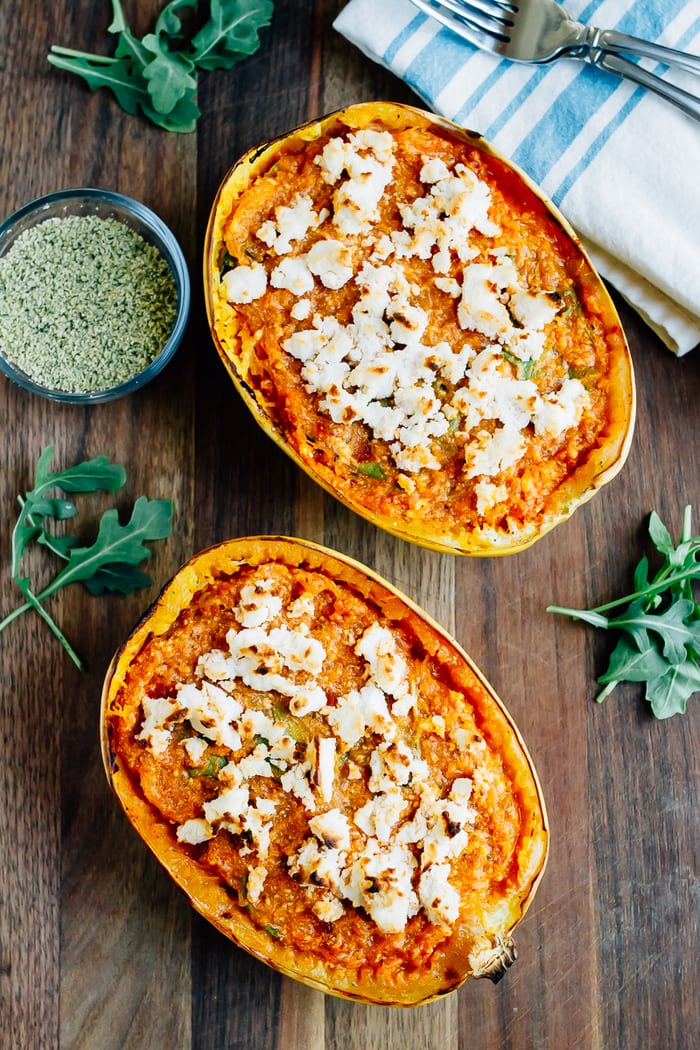 Spaghetti squash lasagna boat with sauce and topped with vegan cheese.