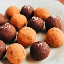 Avocado chocolate truffles on a plate.