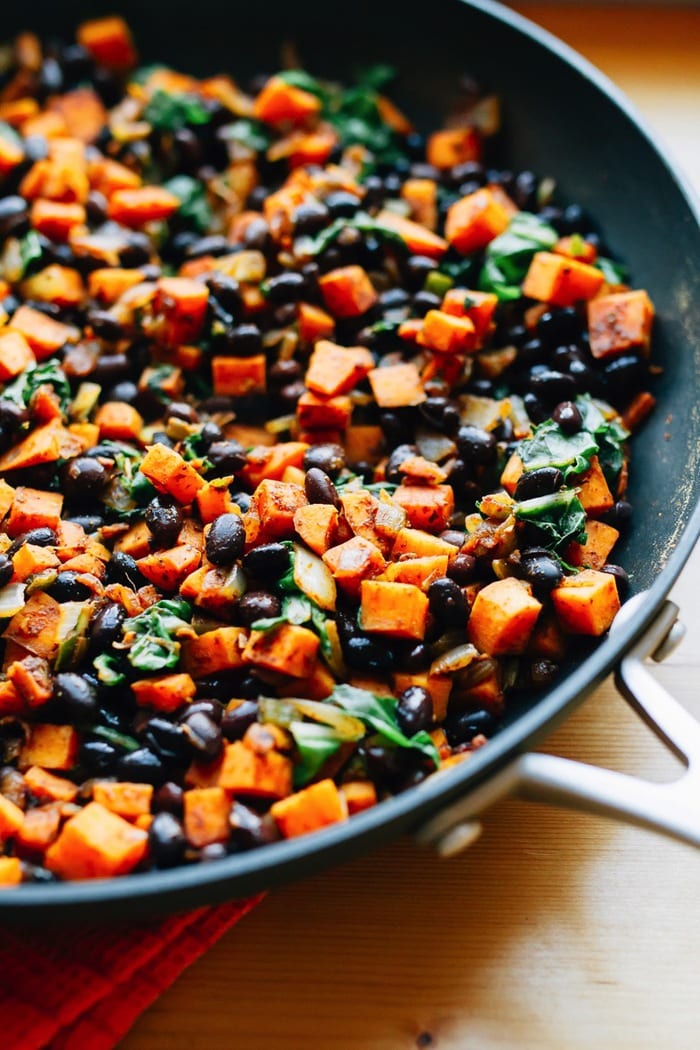 Black beans and sweet potato in a pan.