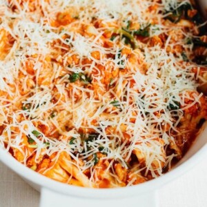 Cauliflower baked ziti topped with parmesan before its cooked.