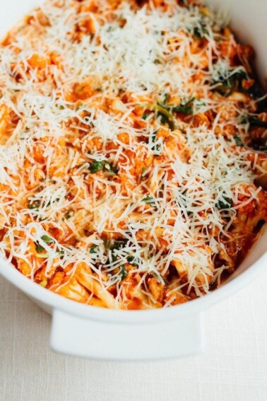 Cauliflower baked ziti topped with parmesan before its cooked.