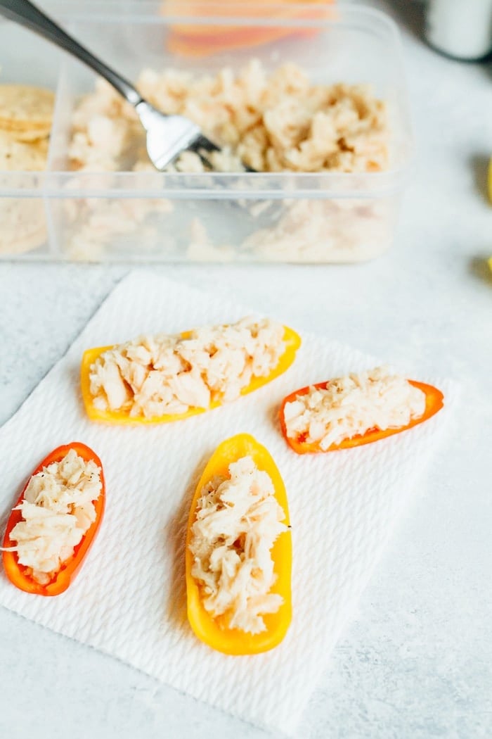 Packable lunch idea featuring a can of tuna, lemon juice, salt and pepper. Serve with mini bell peppers.