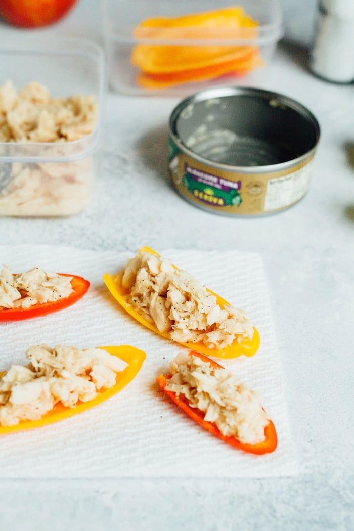 Packable lunch idea featuring a can of tuna, lemon juice, salt and pepper. Serve with mini bell peppers.