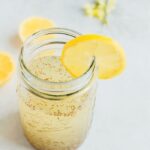 Mason jar of lemon chia fresca with a lemon garnish.