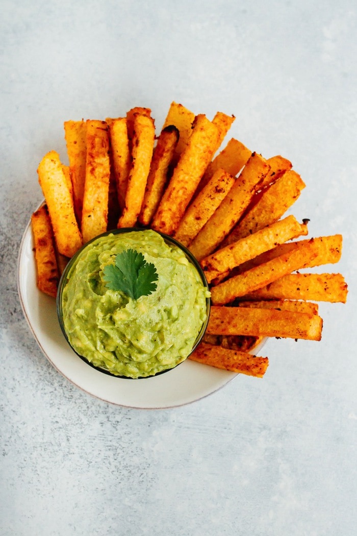 Golden Gut Baked Jicama Fries with Turmeric and Black Pepper. Serve with fresh guacamole for a delicious summer side. 