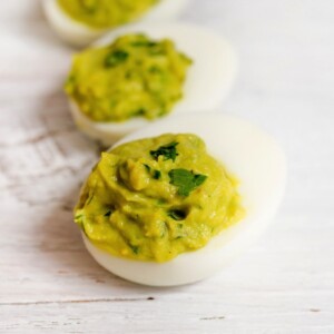 Three avocado deviled eggs.