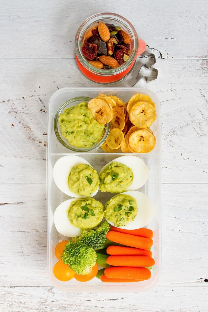 Inspired by the flavor of guacamole, these avocado deviled eggs make for a fun packable lunch idea with plantain chips and veggies! Inspired by the flavor of guacamole, these avocado deviled eggs make for a fun packable lunch idea with plantain chips and veggies!