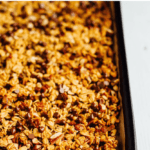 A baking sheet of chocolate pecan pumpkin granola.