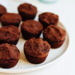 Brownie bites on a white plate.